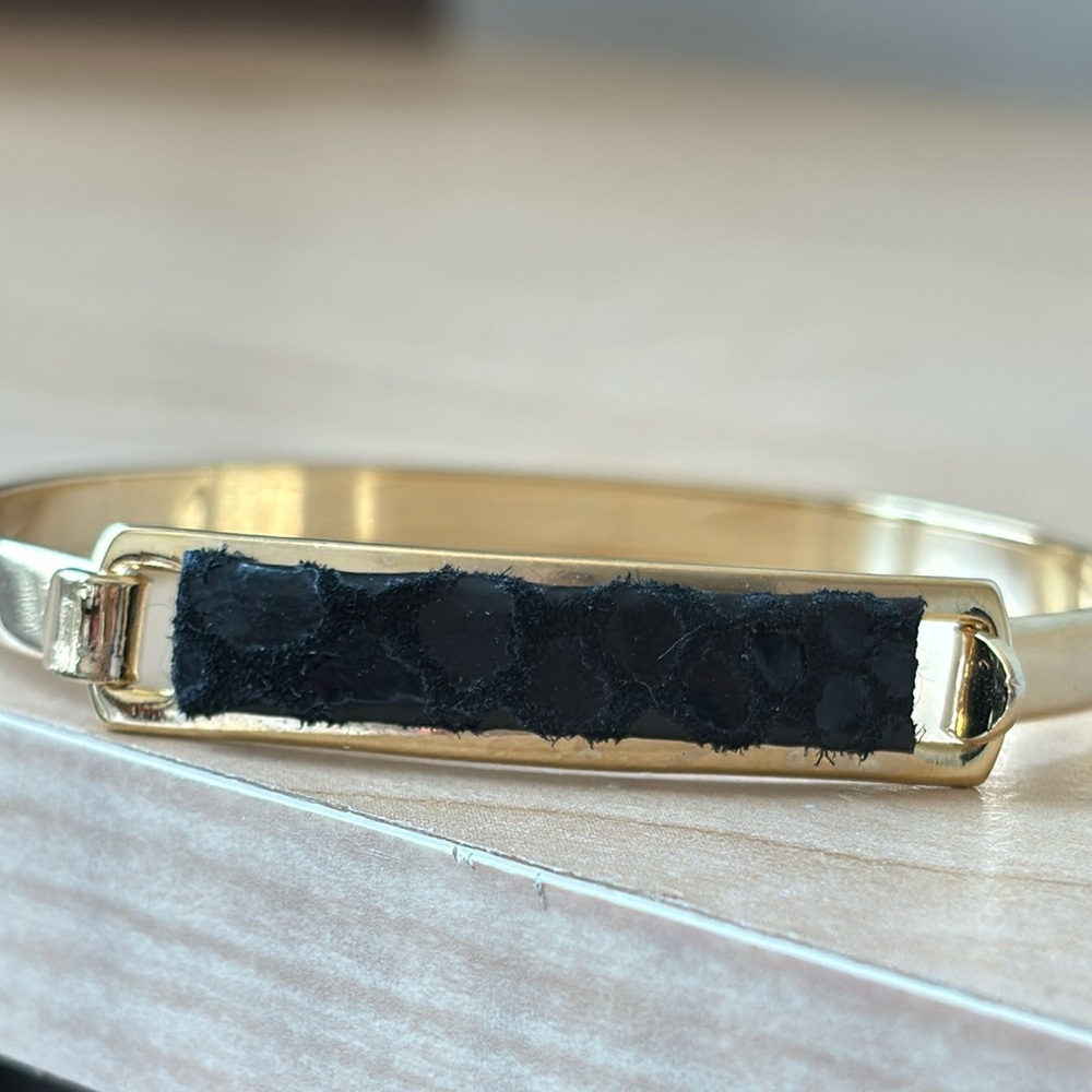 AV cuff bracelet/ gold tone / black leather print/ size 6 1/2